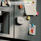 Brick device with a magnetic back mounted on a stainless steel refrigerator door.