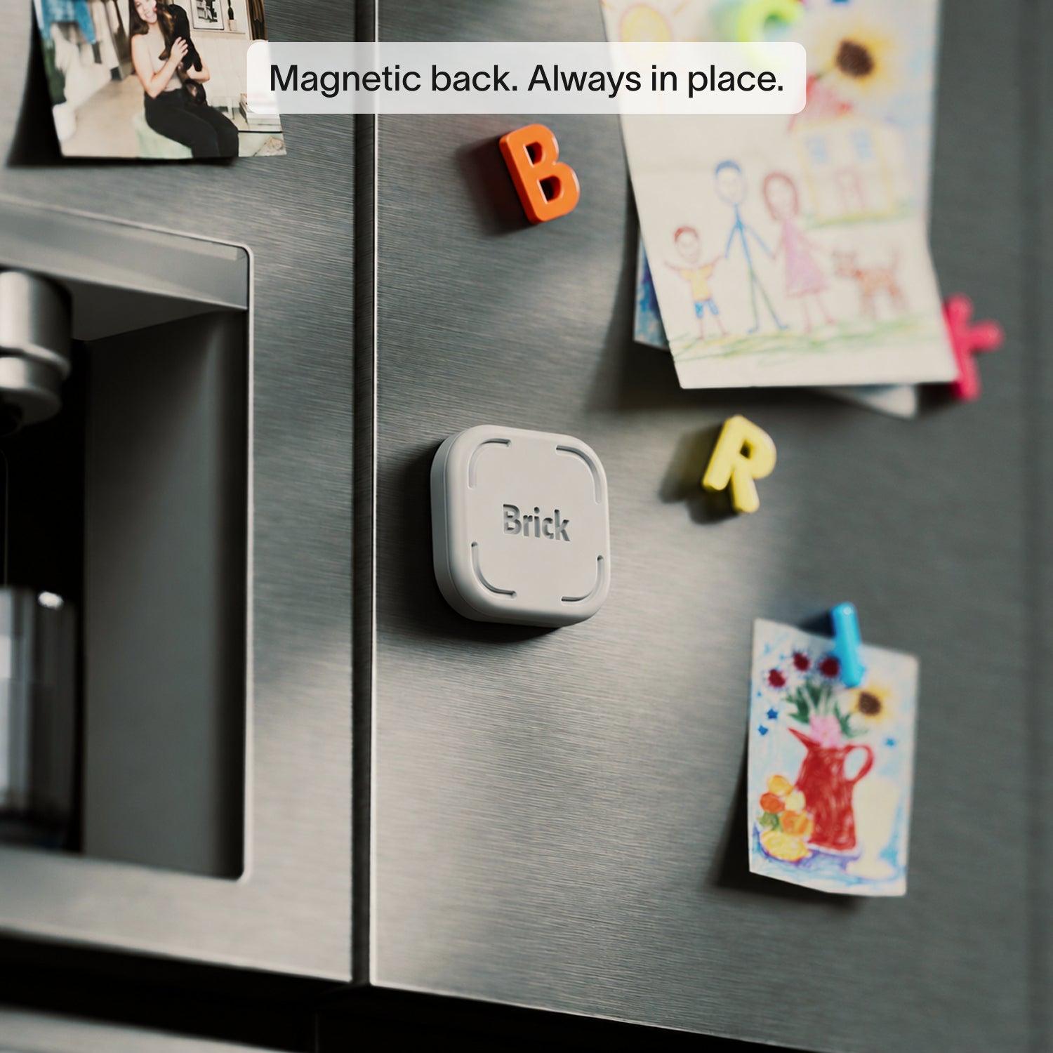 Brick device with a magnetic back mounted on a stainless steel refrigerator door.