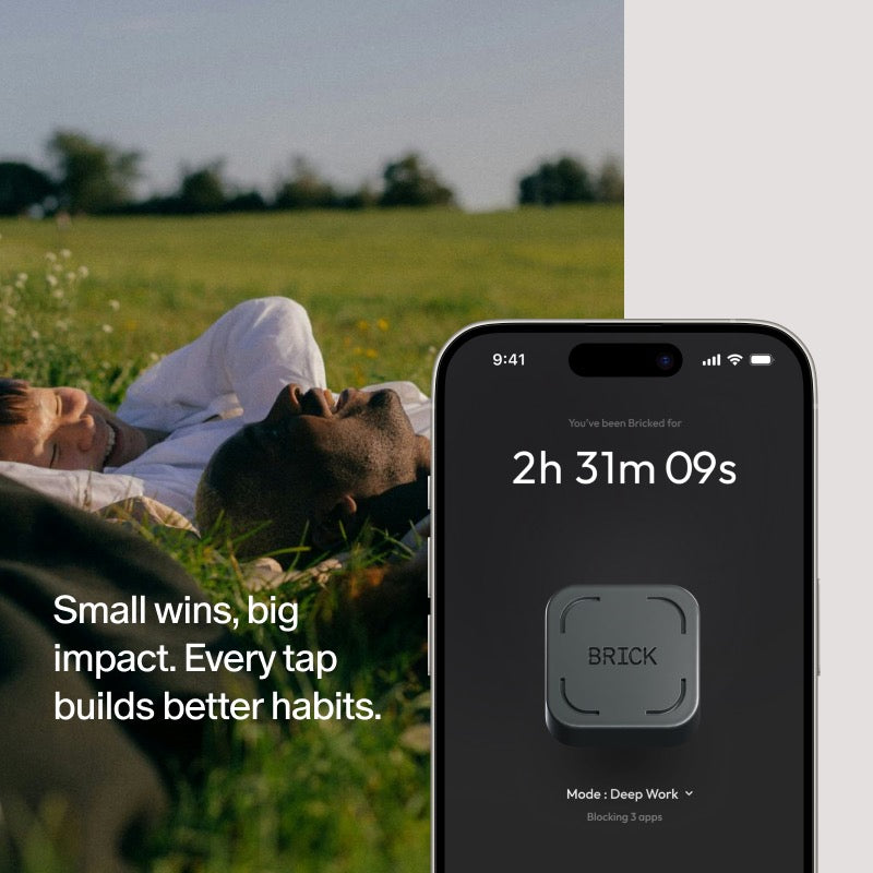 Phone screen showing a productivity app with a person lying on grass in the background